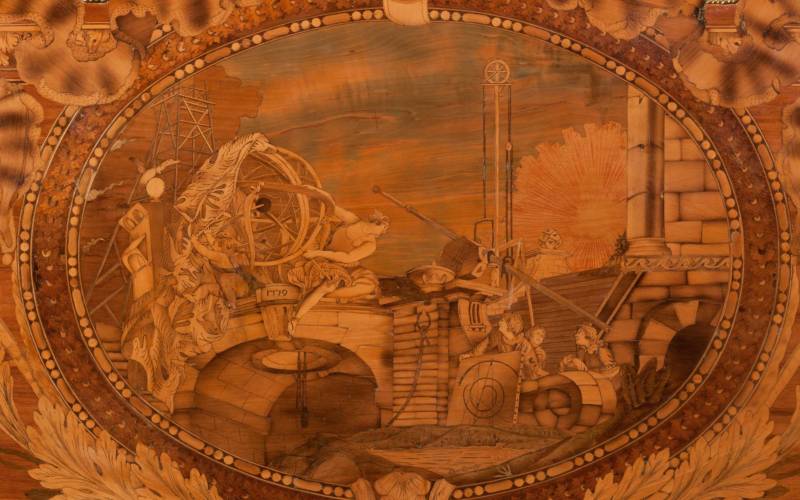 Roll-top desk decorated with marquetry images reflecting the interests of Caron de Beaumarchais and elaborate gilt-bronze mounts.
