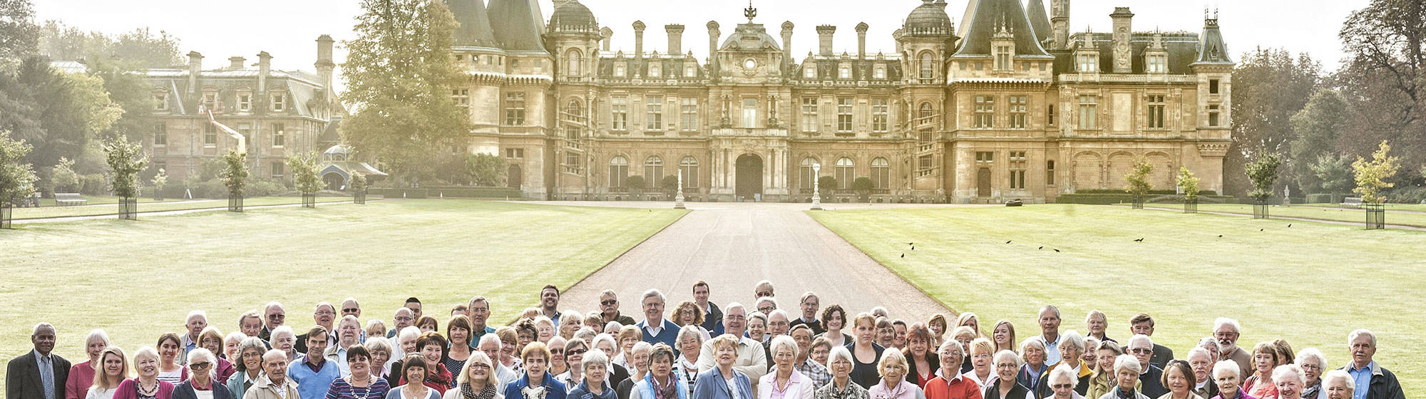 Group of volunteers standing in front of Waddesdon Manor north front