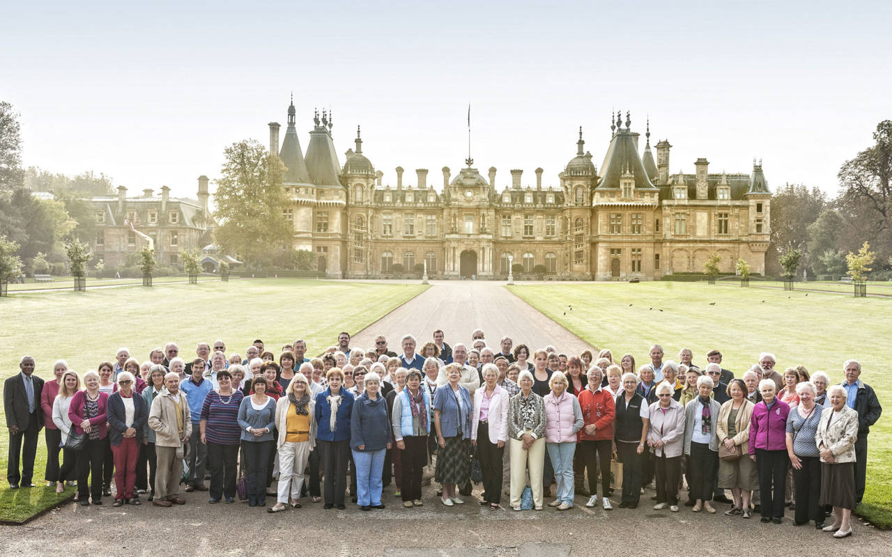 Group of volunteers standing in front of Waddesdon Manor north front