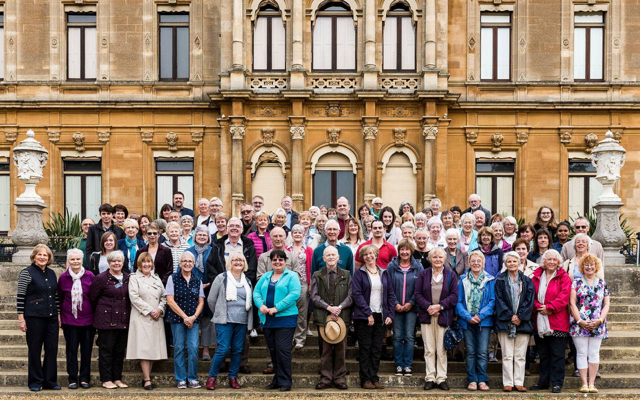 Group of volunteers standing in front of Waddesdon Manor