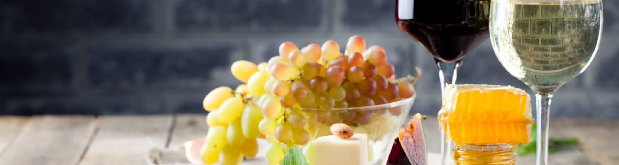 A selection of cheese and wine laid out on a table