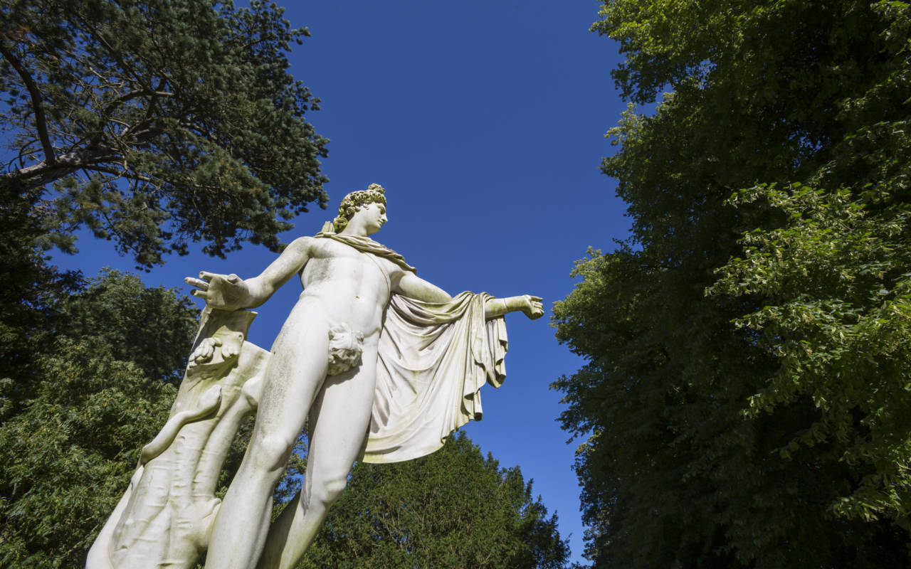 White sculpture of Apollo from below