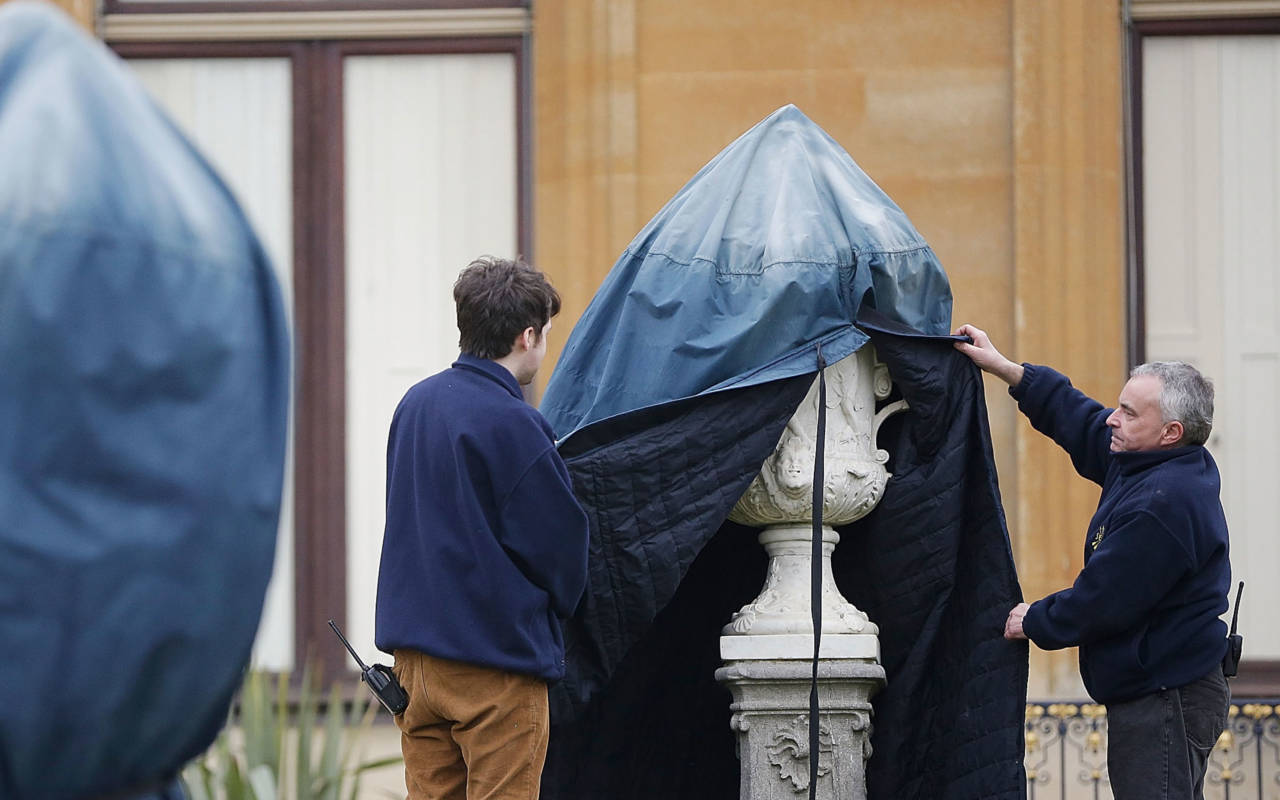 Conservation Assistants uncovering a vase on the Parterre