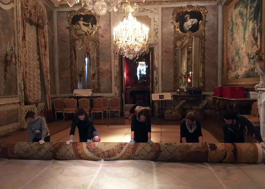 Stewards rolling the Dining Room carpet