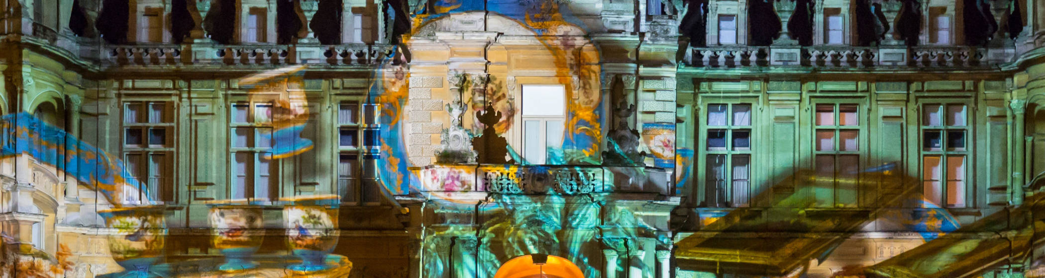 Paintings and furniture from Waddesdon's collection projected on to the North front