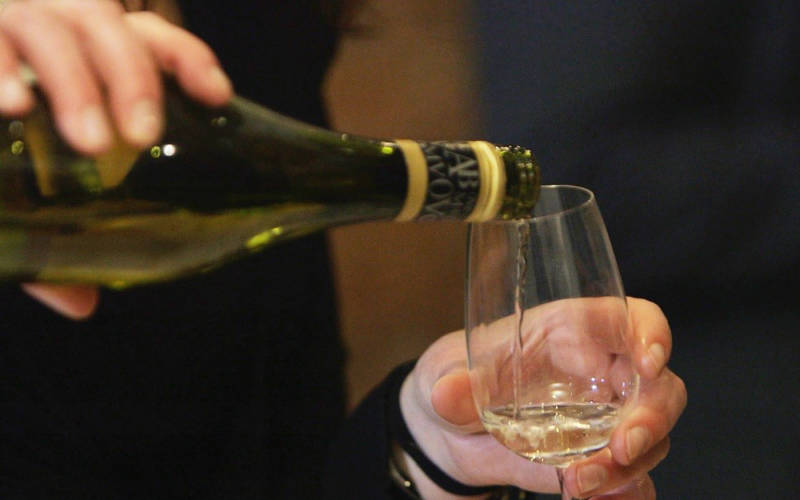 White wine being poured into a glass