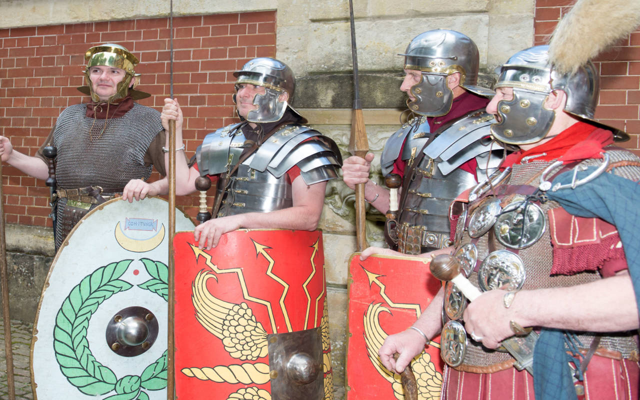 Group of reenactors dressed as Roman Soldiers