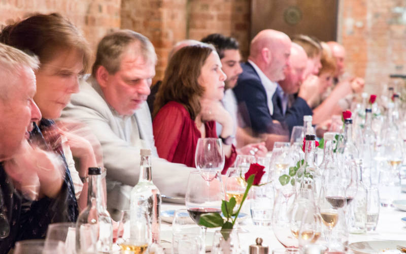People enjoying a wine event in the cellars