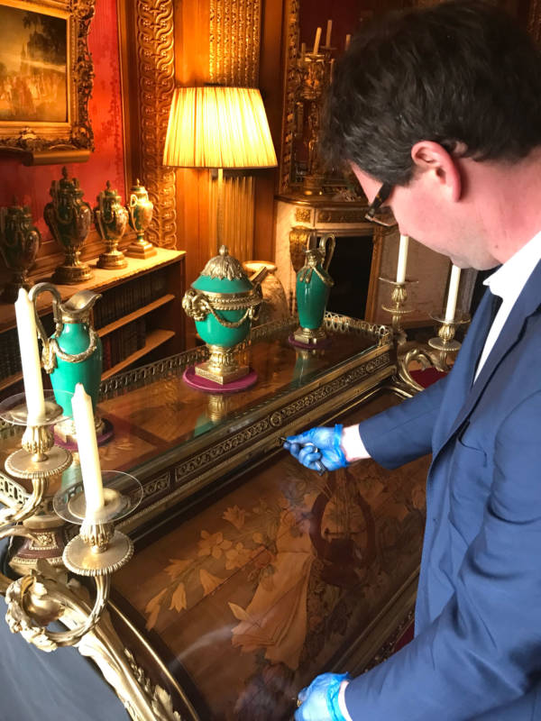 Here Michael demonstrates the locking mechanism on Riesener's roll-top 19th century desk.