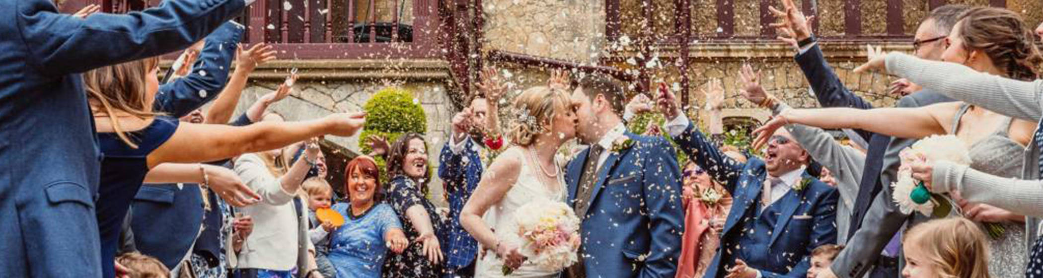 Wedding party throwing confetti